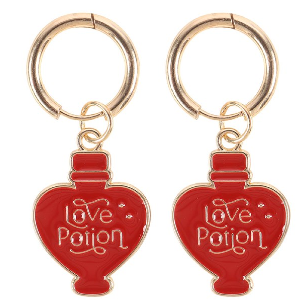 Dangly earrings shaped like red love potion bottles finished with gold detailing, hanging from gold-effect hoops.