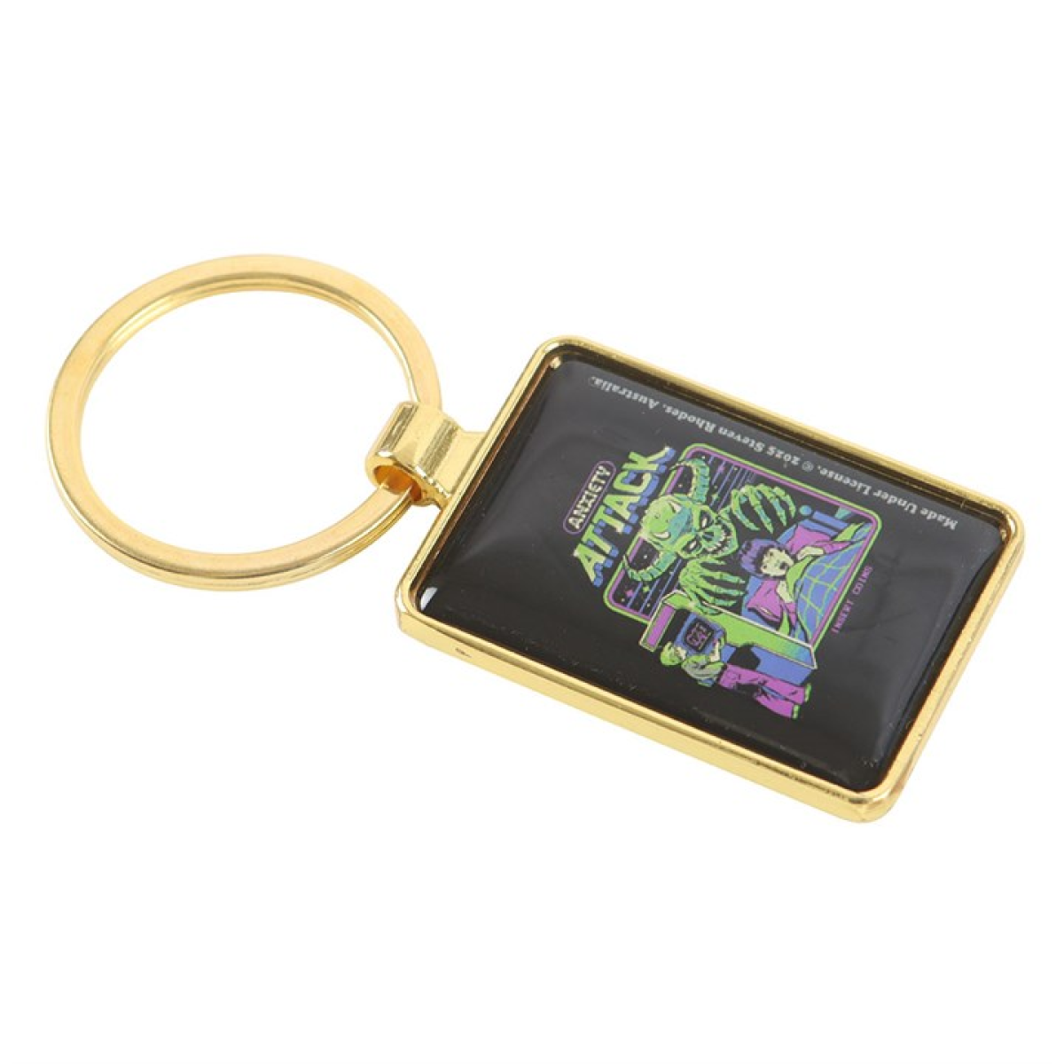 Steven Rhodes enamel keyring depicting a young boy in bed with a demon rising behind the headboard. In the corner is another young boy playing a retro gaming console. Text reads 'Anxiety Attack'.