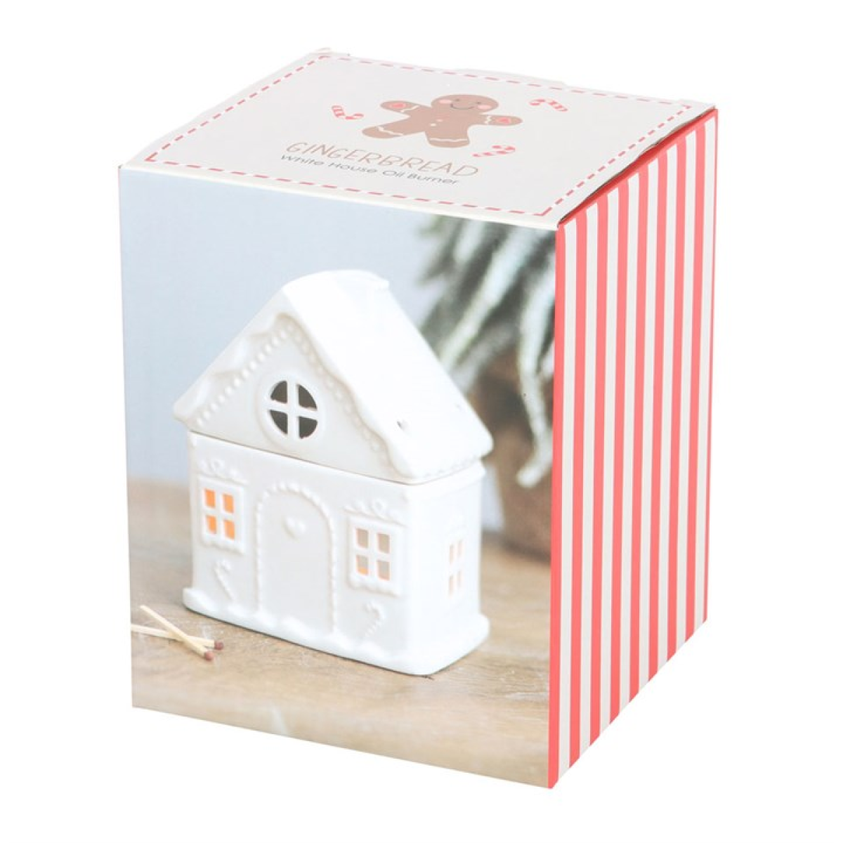 Ceramic wax melter and oil burner shaped like a traditional gingerbread house. Presented in a themed box.