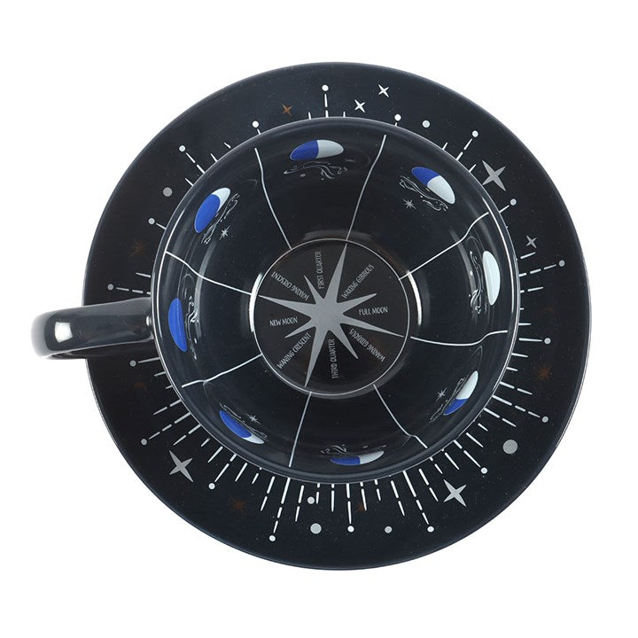 Black ceramic teacup and saucer set. Depicts the phases of the moon and can be used for personal insight and tea-leaf reading. Instructions included. Inside detailing view.