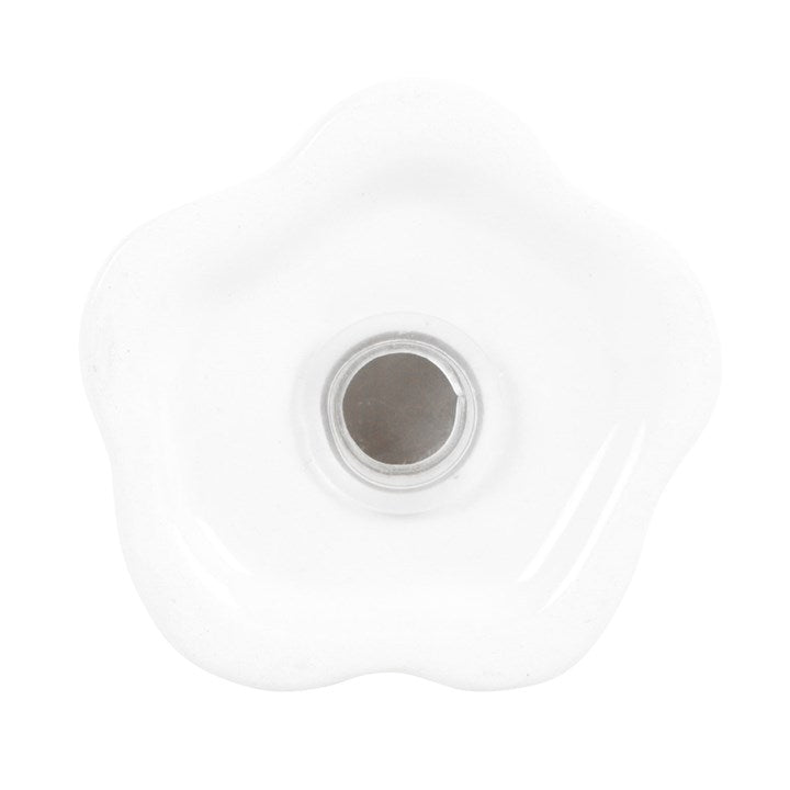 Close up of stopper closure on bottom of ghost shaped salt shaker.
