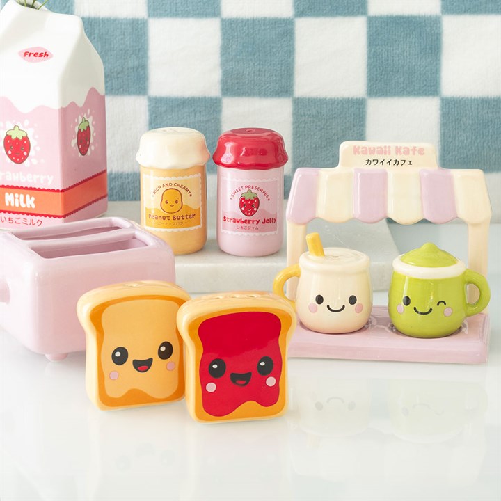 Two kawaii style toast salt and pepper shakers with peanut butter and jam detailing, sold with complementary pink toaster-shaped holder. Presented alongside other items from the same range.