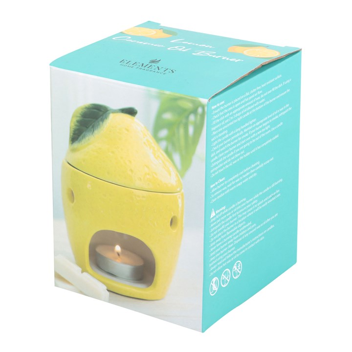 Lemon shaped ceramic wax melter and oil burner. Presented in themed box.