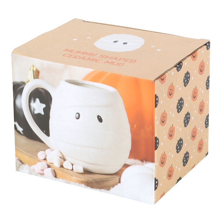 White ceramic mug shaped like an adorable Halloween Mummy. Presented in a themed box.