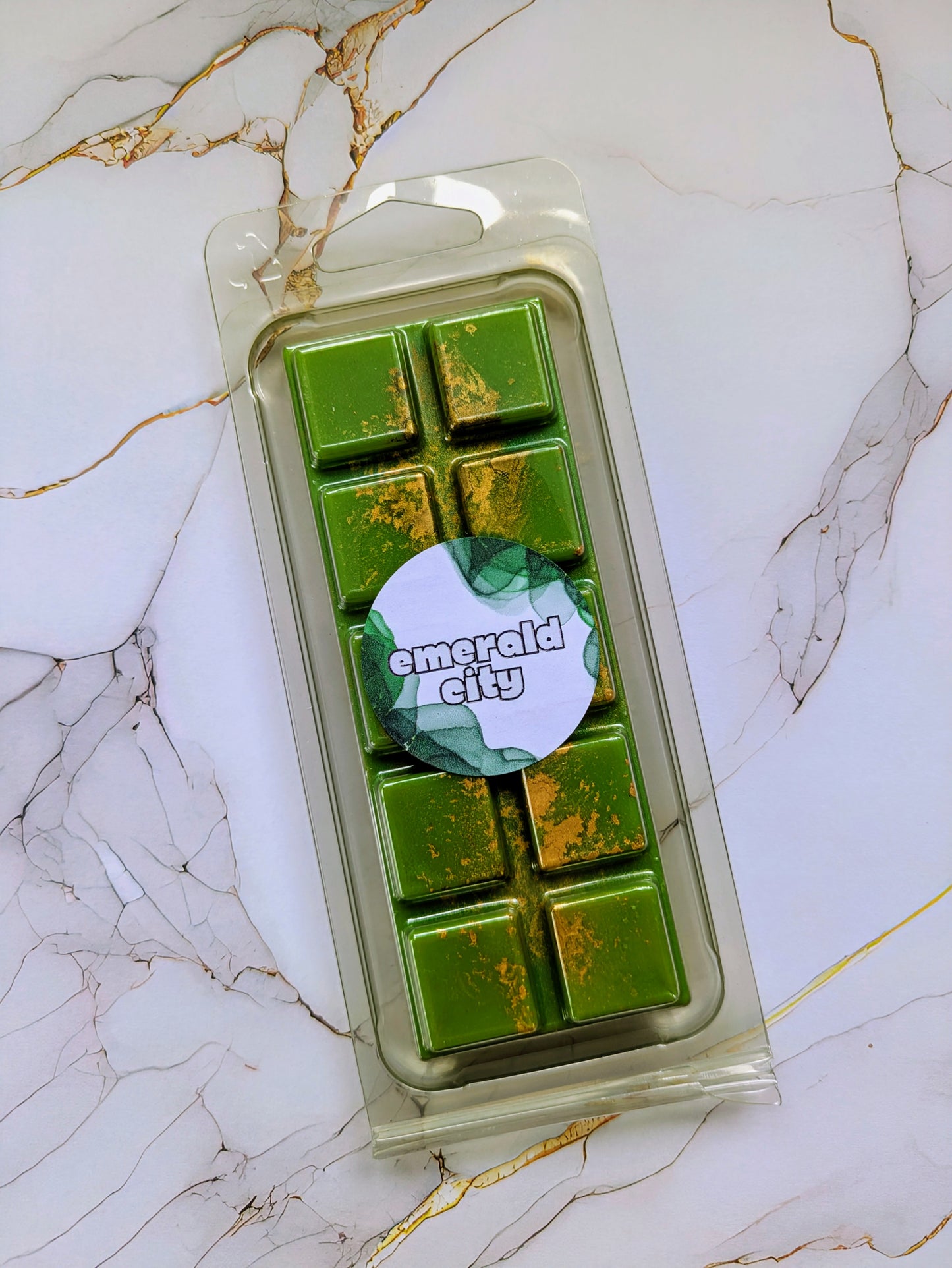 Emerald City coconut wax melt. Olive green snap bar with gold shimmer accents.
