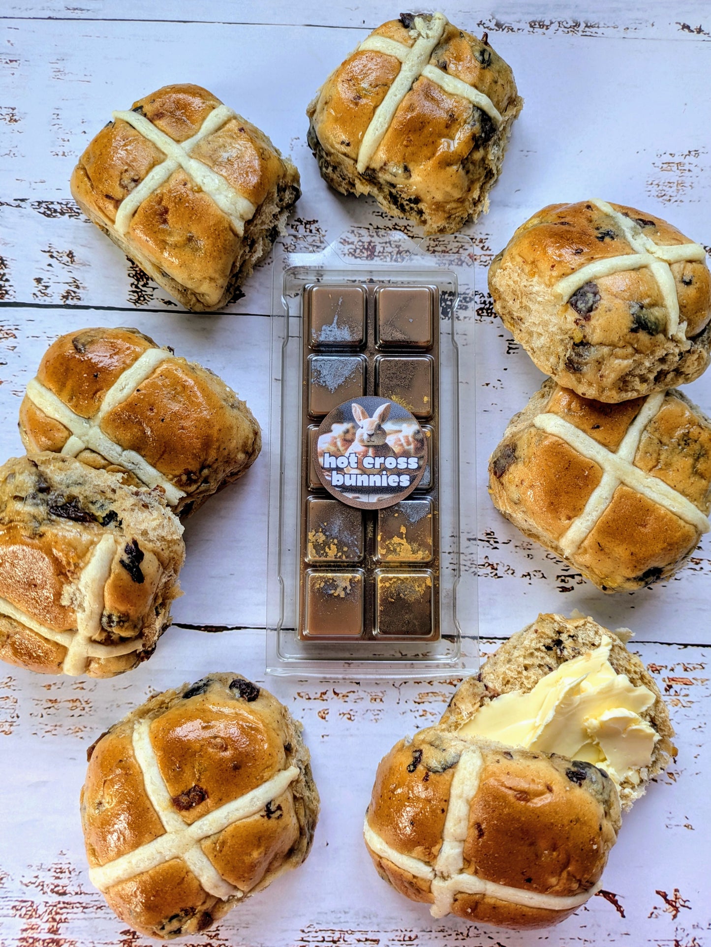Hot Cross Bunnies coconut wax melt. Dark brown snap bar with gold and metallic silver shimmer accents.