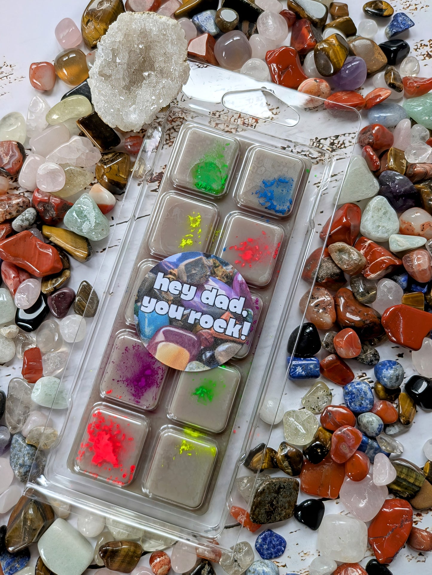 Hey Dad, You Rock! coconut wax melt. Grey snap bar with florescent green, blue, yellow, red and purple shimmer accents.