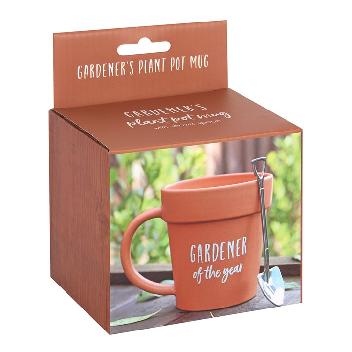 Ceramic terracotta-coloured mug which looks like a plant pot. Includes a shovel shaped spoon and 'Gardener of the Year' text.