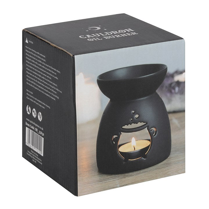 Black ceramic wax melter and oil burner, with charming bubbling cauldron cut out. Presented in themed box.