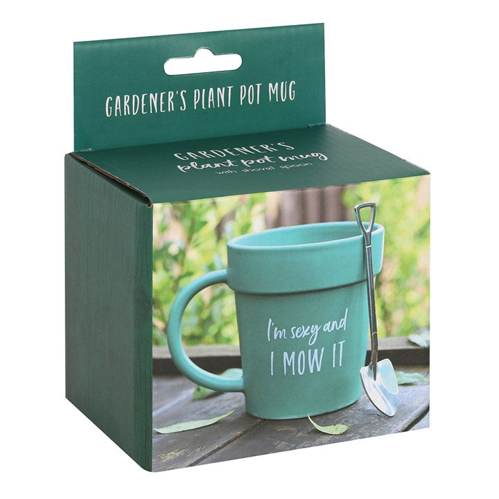 Ceramic green terracotta plant pot shaped mug with shovel-shaped spoon and 'I'm Sexy and I Mow It' text.