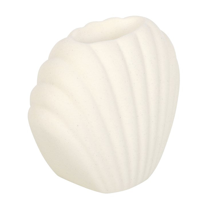White, shell-shaped ceramic wax melter and oil burner.
