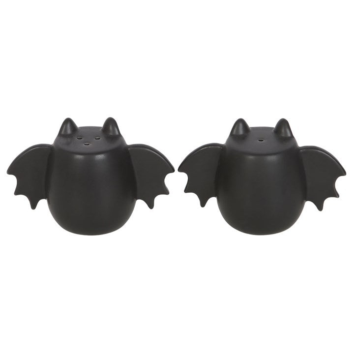 Two black bat-shaped salt and pepper shakers.