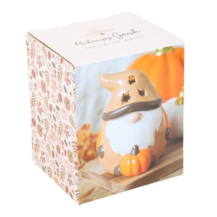 Autumnal ceramic gonk wax melter and oil burner with leaf-shaped cutouts and pumpkin. Presented in a themed box.
