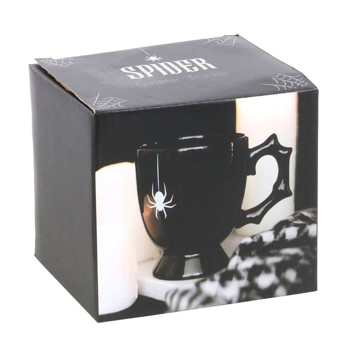 Black gothic-style ceramic mug with thorny-design handle and charming spider detailing. Presented in a themed box.