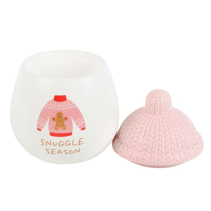 Ceramic snuggle season wax melter and oil burner, topped with a bobble hat-shaped lid.