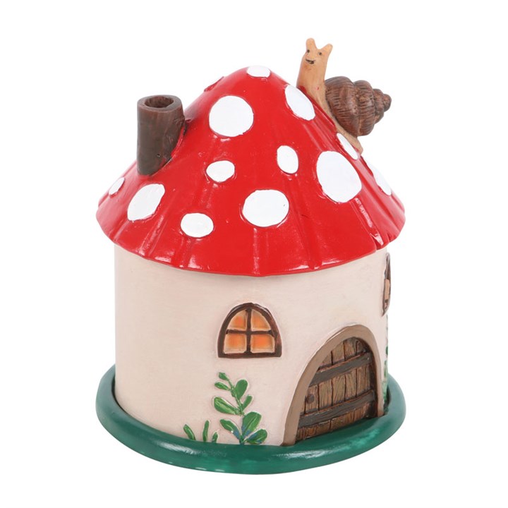 Ceramic incense cone burner shaped like a whimsical mushroom house, topped by a charming snail.