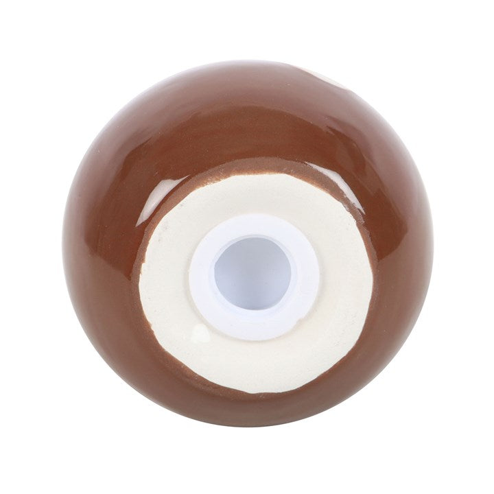 Close up of stopper closure on christmas pudding shaped salt shaker.