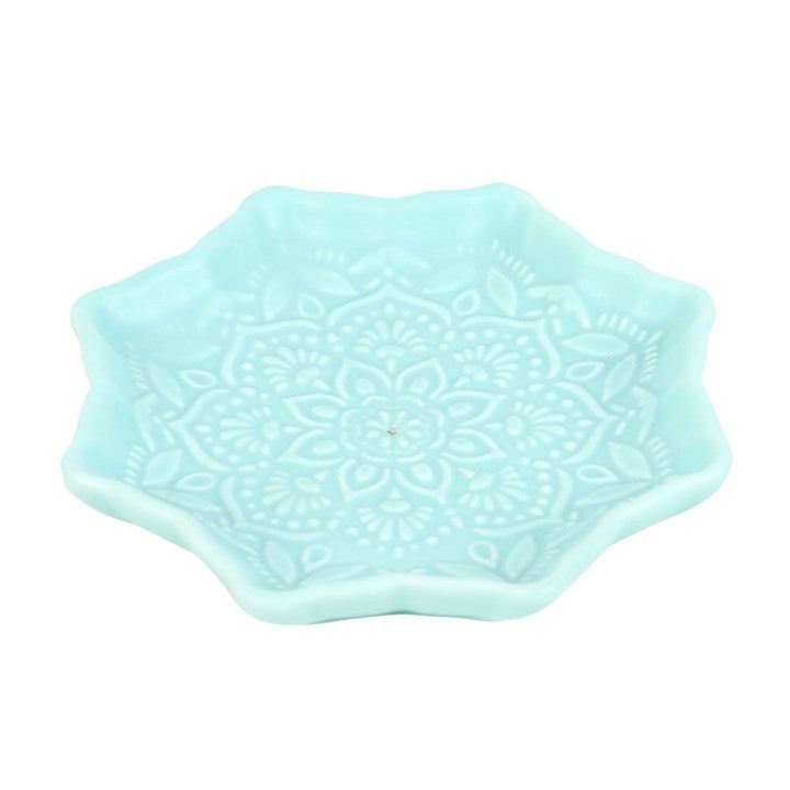 Blue mandala shaped incense stick holder.