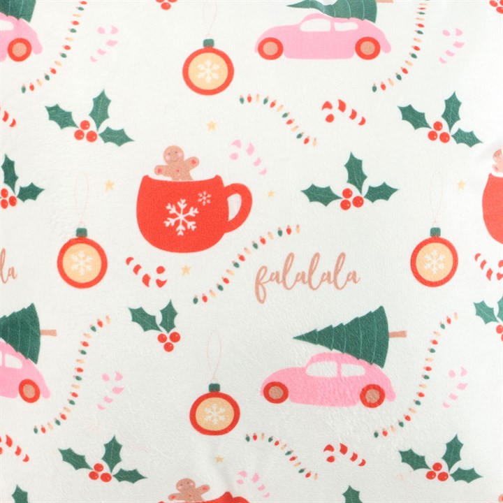 Square decorative cushion with a traditional Christmas icons motif. Fluffy pink pom-pom embellishments add a modern twist. Close up.