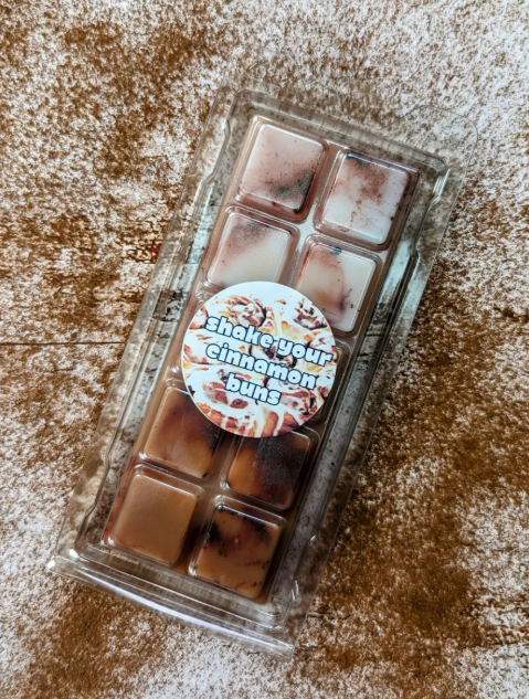 Shake Your Cinnamon Buns coconut wax melt. Deep brown snap bar with dark brown shimmer accents.