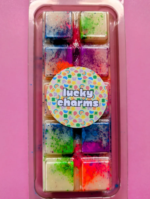 Lucky Charms coconut wax melt. Cream snap bar with green, blue, pink and orange shimmer accents.