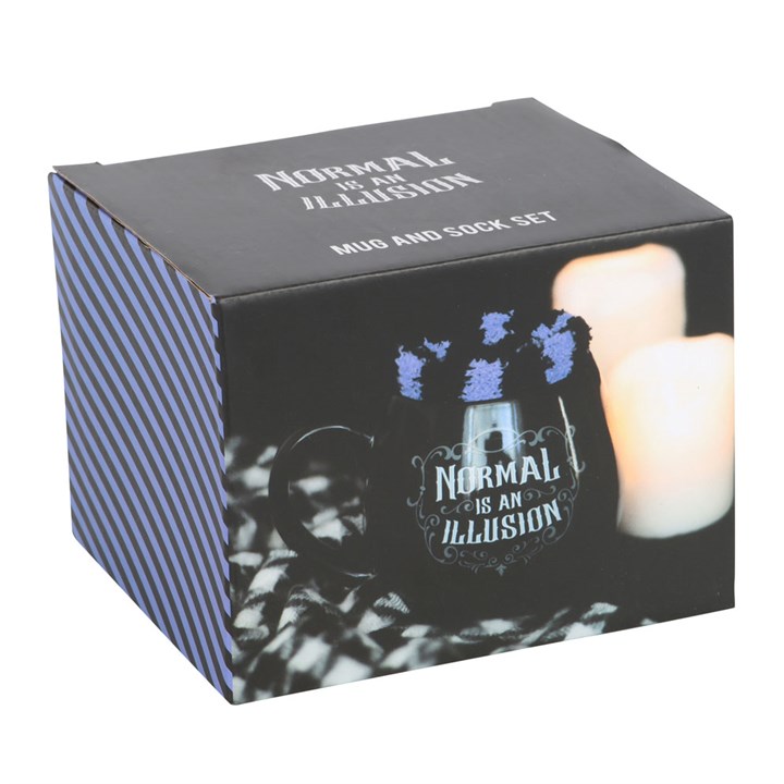 Black rounded ceramic mug finished with Normal is an Illusion text, matched with a pair of black and purple fluffy socks. Presented in a themed box.
