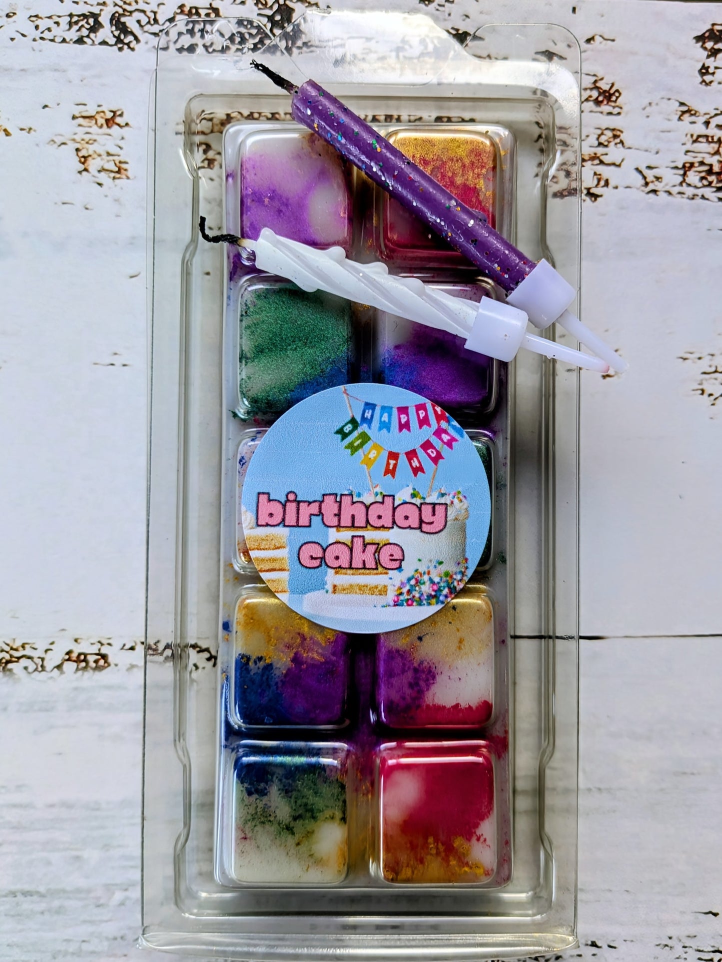 Birthday Cake coconut wax melt. White snap bar with red, purple, golden, pink, blue shimmer accents.
