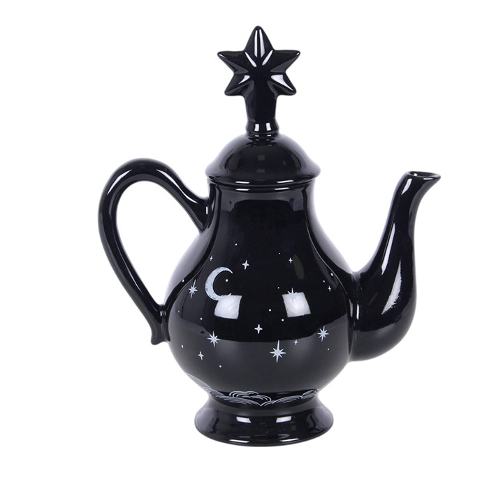 Striking tea pot with celestial design on a black background and a star-capped lid. 