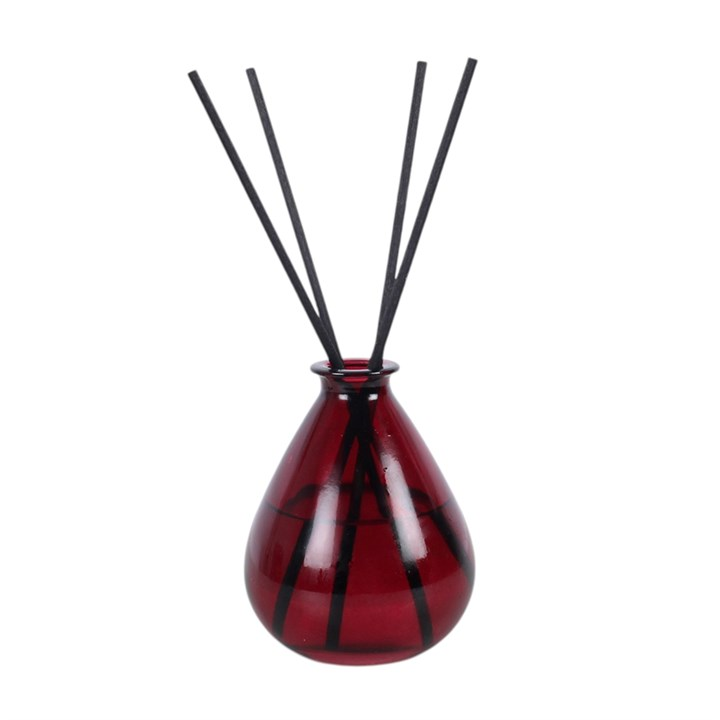 Dragon's Blood reed diffuser, presented in a deep purple teardrop glass bottle. 