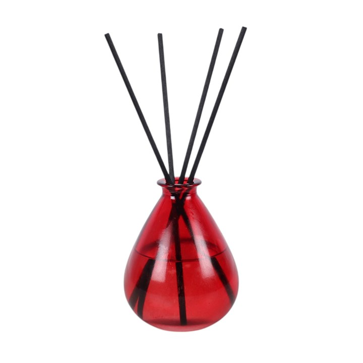 Blood Moon reed diffuser, including deep pink teardrop-shaped glass bottle and reeds. 