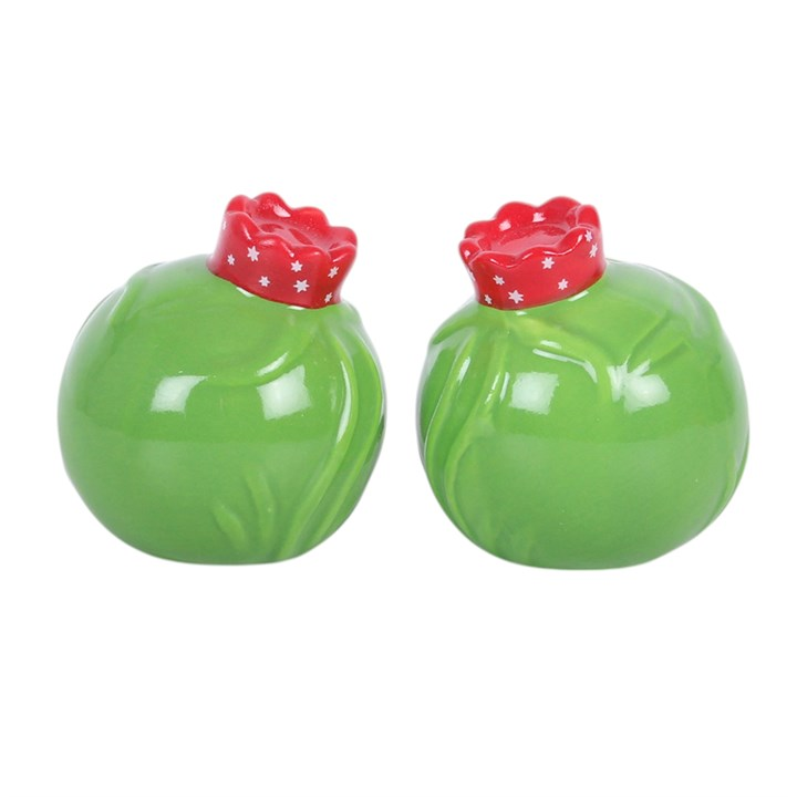 Adorable set of salt and pepper shakers, designed as two smiling Brussel sprouts topped with festive crowns.
