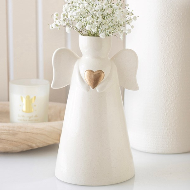 Sentimental ceramic flower vase, shaped like an angel with extended wings and a gold heart embellishment.