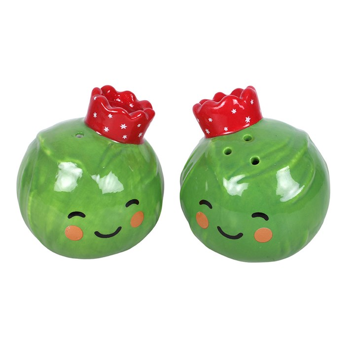 Adorable set of salt and pepper shakers, designed as two smiling Brussel sprouts topped with festive crowns.