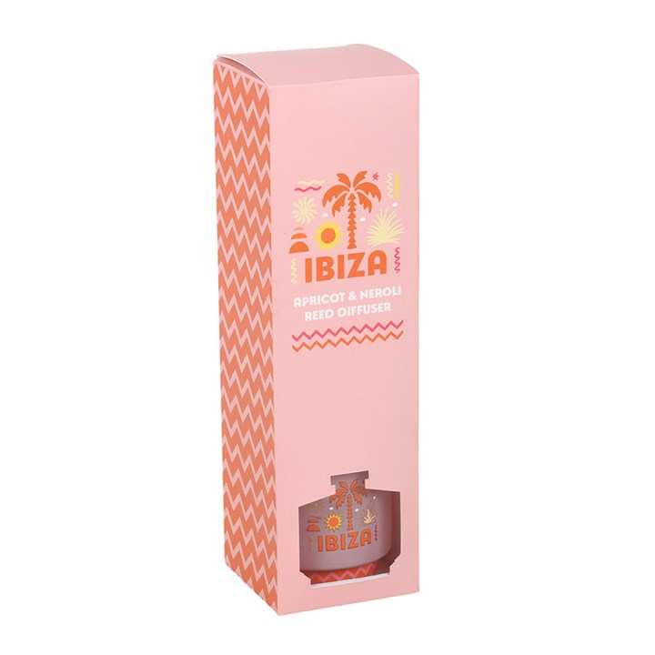 Ibiza reed diffuser, a soft pink bottle with orange palm tree and coastline inspired design. 