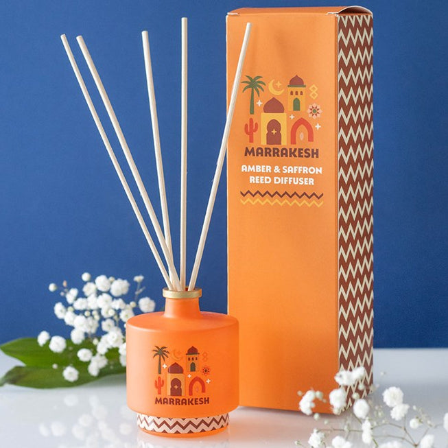 Marrakesh reed diffuser. Striking amber glass bottle with Moroccan architecture design. 