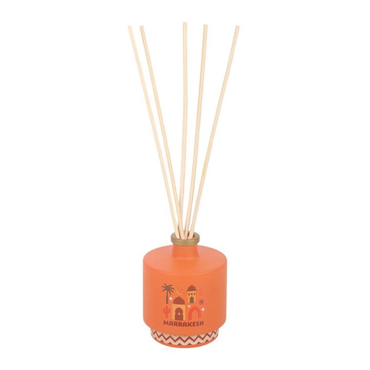 Marrakesh reed diffuser. Striking amber glass bottle with Moroccan architecture design. 