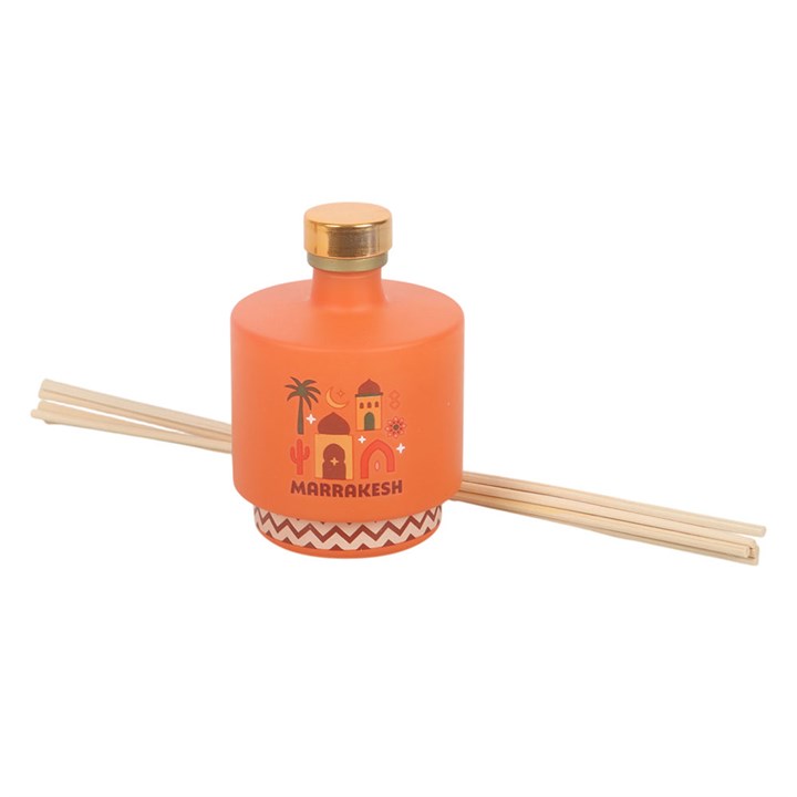 Marrakesh reed diffuser. Striking amber glass bottle with Moroccan architecture design. 