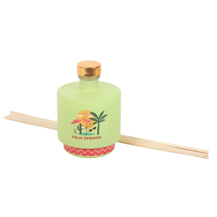 Palm Springs reed diffuser. Lime green bottle with palm tree and flamingo design. 