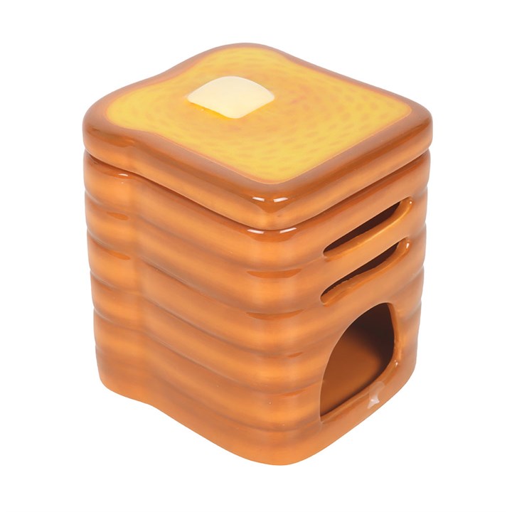 Stack of toast shaped ceramic wax melter and oil burner.
