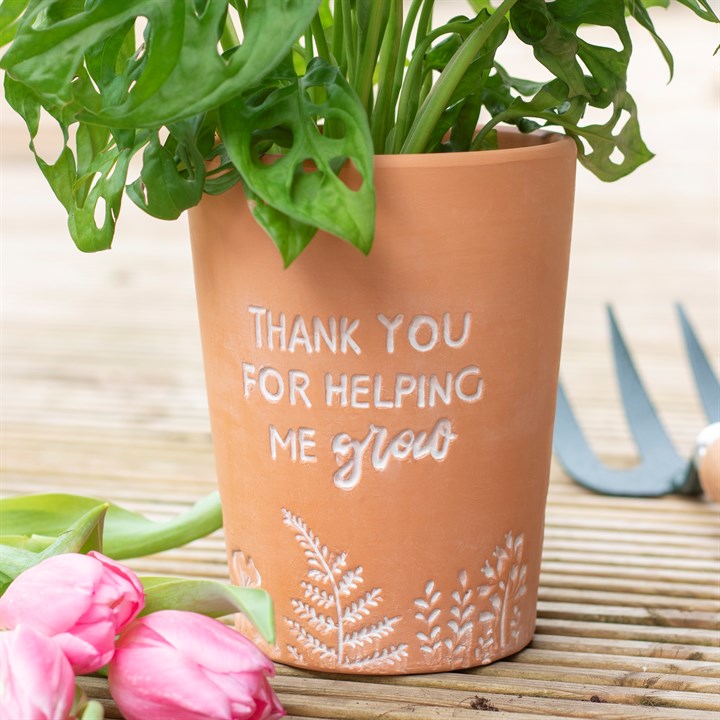Terracotta plant pot with charming Thank You For Helping Me Grow text and fauna detailing.