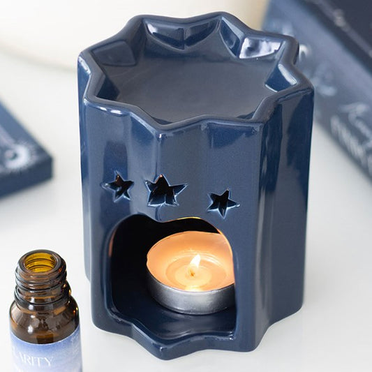 Blue ceramic oil burner, shaped like a celestial eight-point star. 