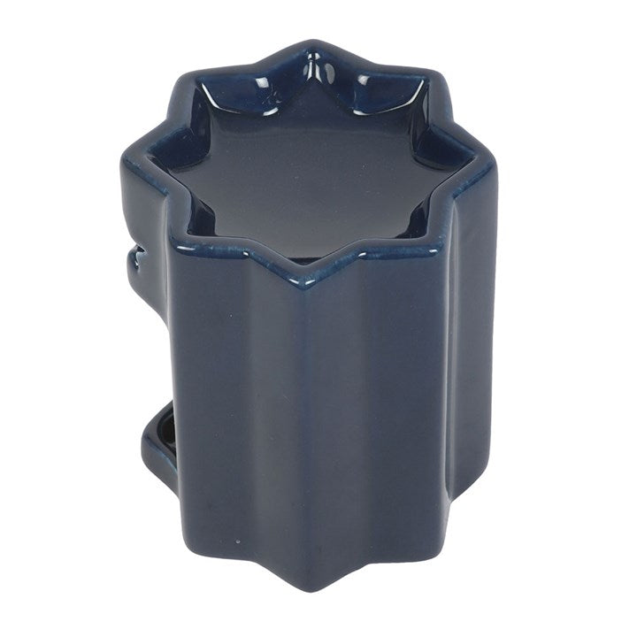 Blue ceramic oil burner, shaped like a celestial eight-point star. 