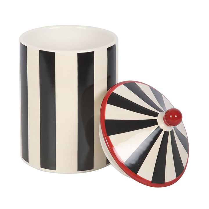 Black and white striped circus tent shaped storage jar.