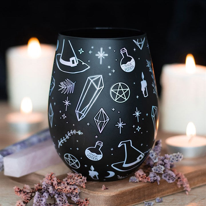 Black stemless wine glass decorated with a crystal, potion, witches hat motif.