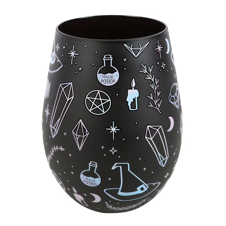 Black stemless wine glass decorated with a crystal, potion, witches hat motif.
