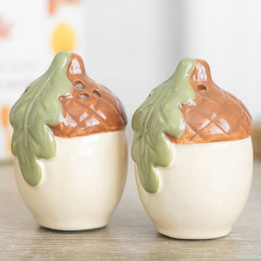 Ceramic acorn-shaped salt & pepper shaker set. 