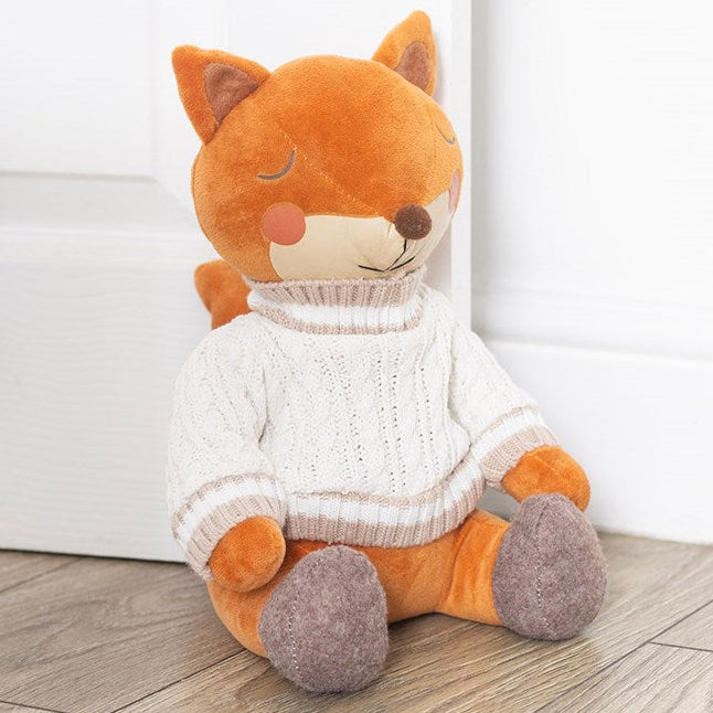 Charming woodland-themed doorstop, shaped like a cheerful fox wearing a white knitted jumper. 