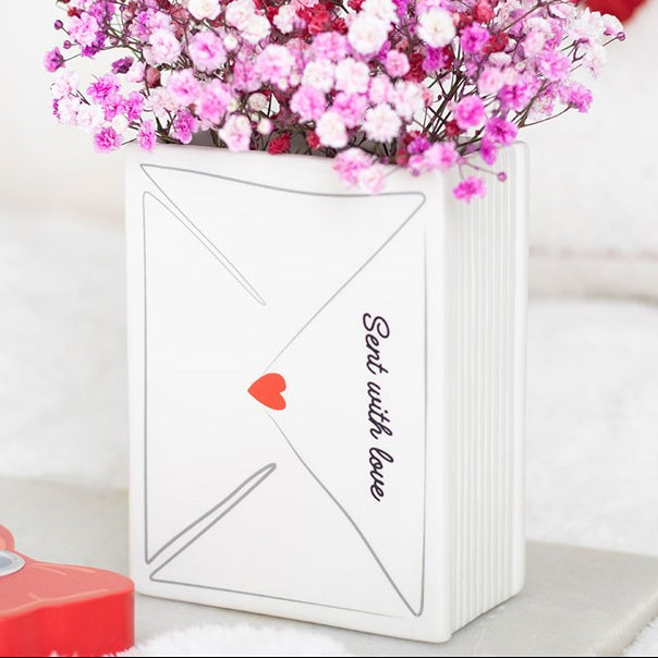 Ceramic flower vase shaped like a love note, complete with heart stamp and 'Sent With Love' text.