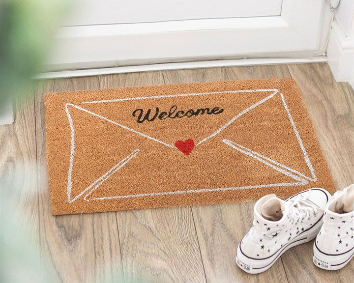 Decorative natural doormat with charming love-letter envelope design and 'Welcome' text. 