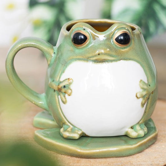Frog shaped ceramic mug with matching lily pad shaped coaster.
